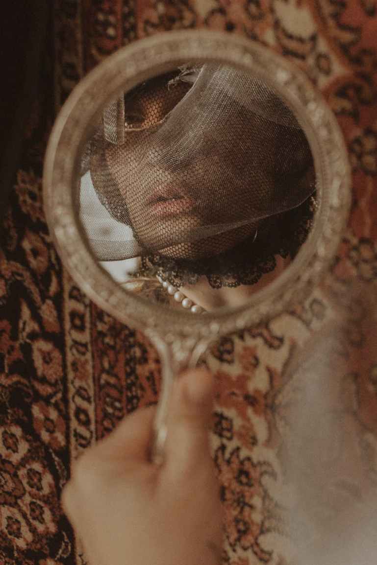 woman looking to a mirror