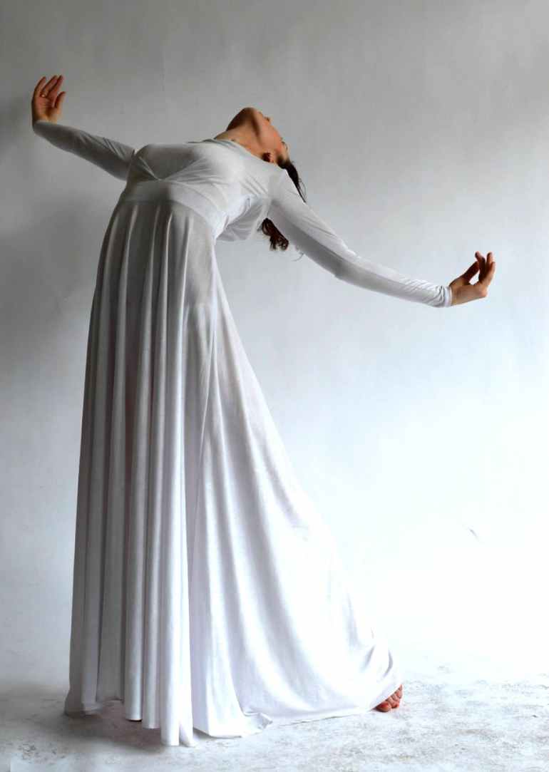 woman wearing white long sleeve dress