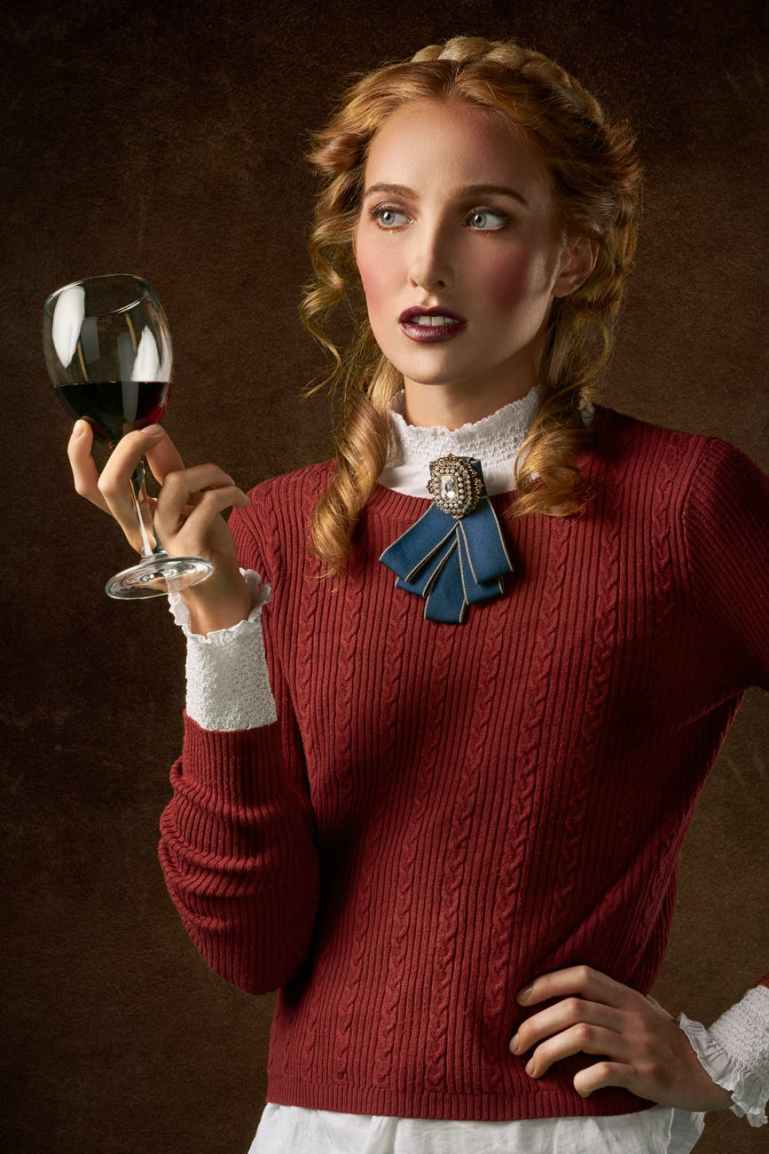photo of woman holding wine glass