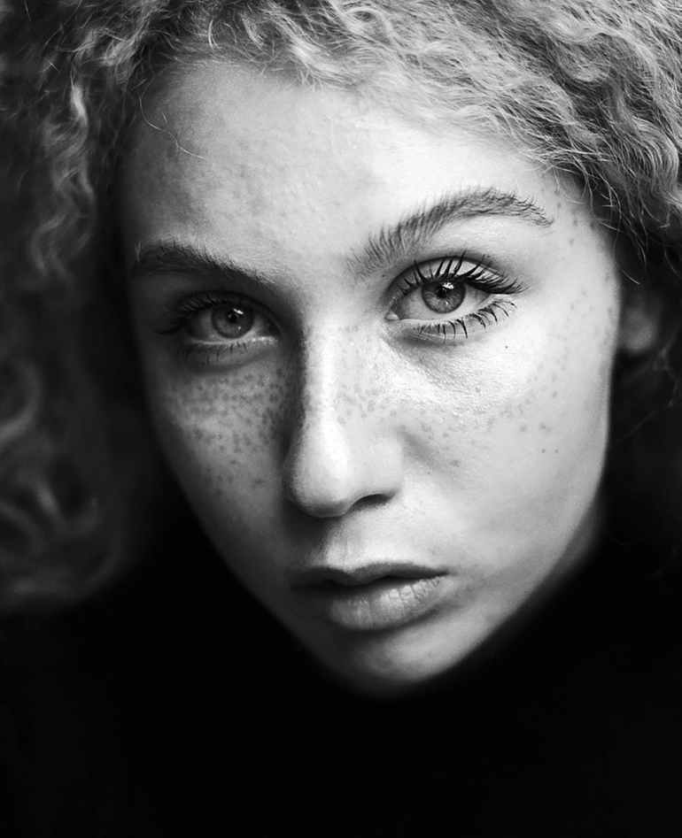 grayscale photo of woman s face