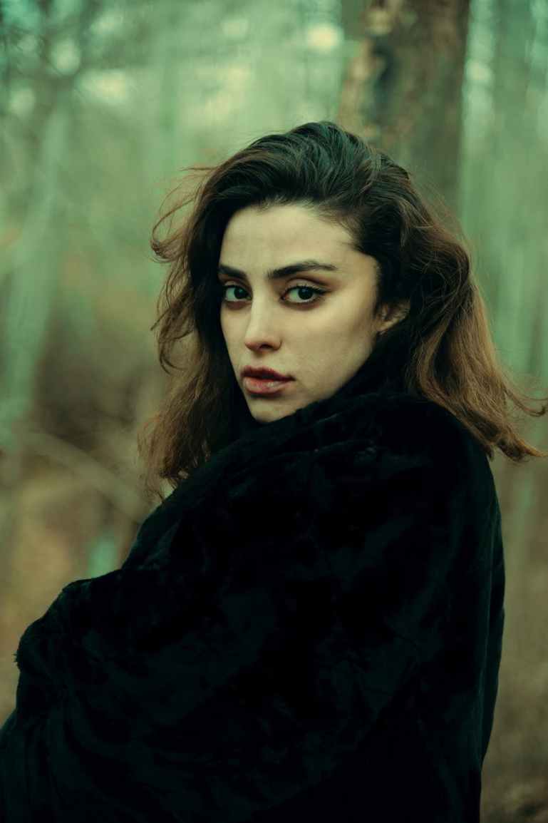 woman in black fur coat