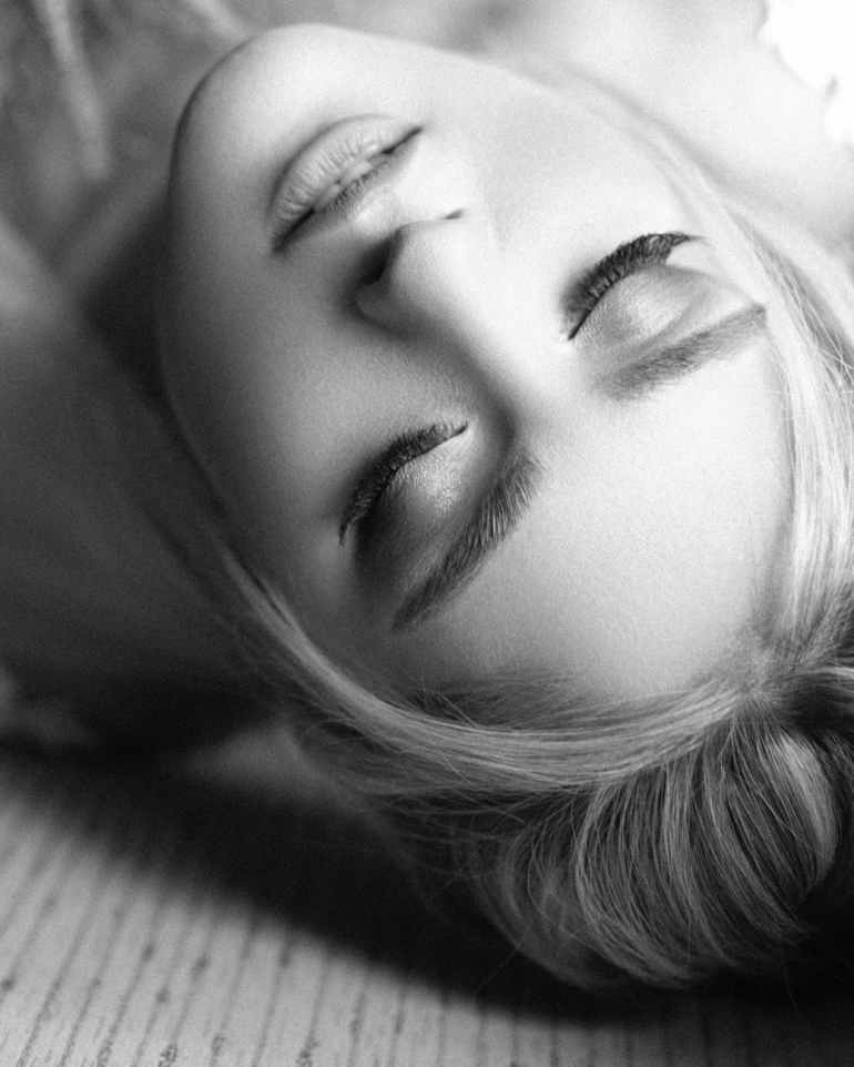 womans face in grayscale