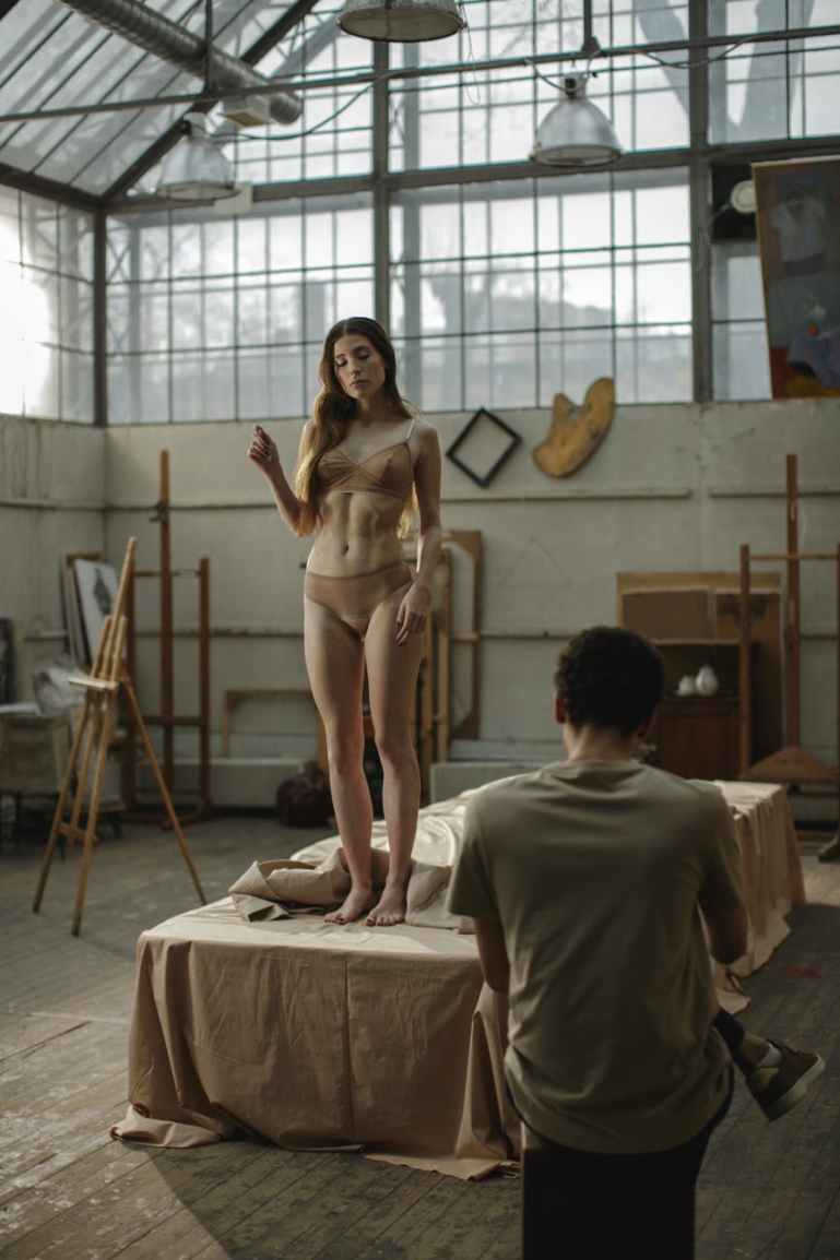 woman in under garment standing in the platform