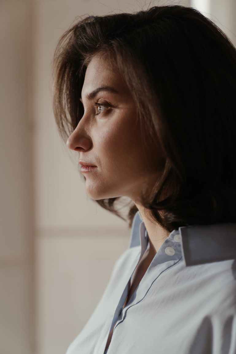 woman in white collared shirt