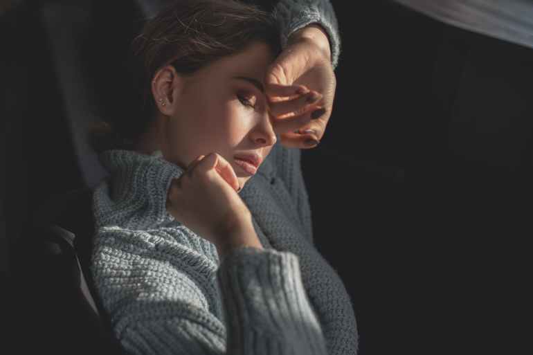 woman in gray knit sweater