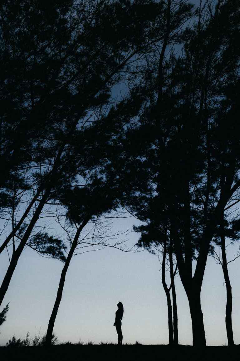 silhouette photography of person standing outdoors