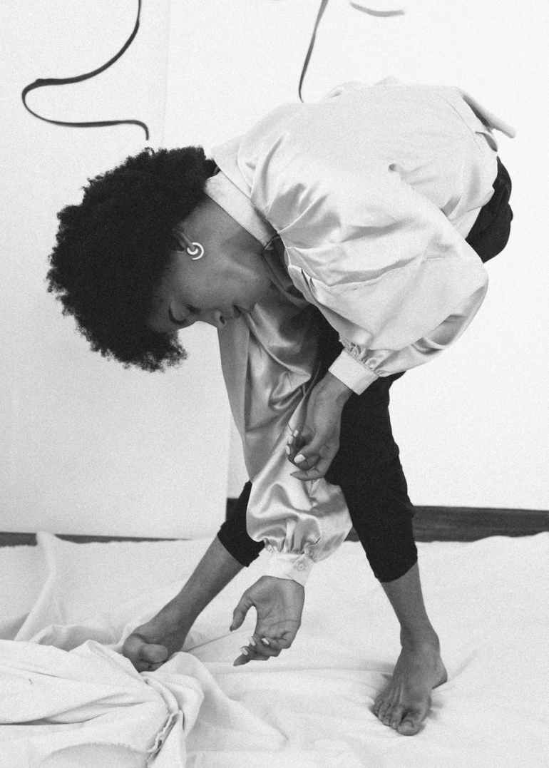 ethnic androgynous man dancing gracefully in studio